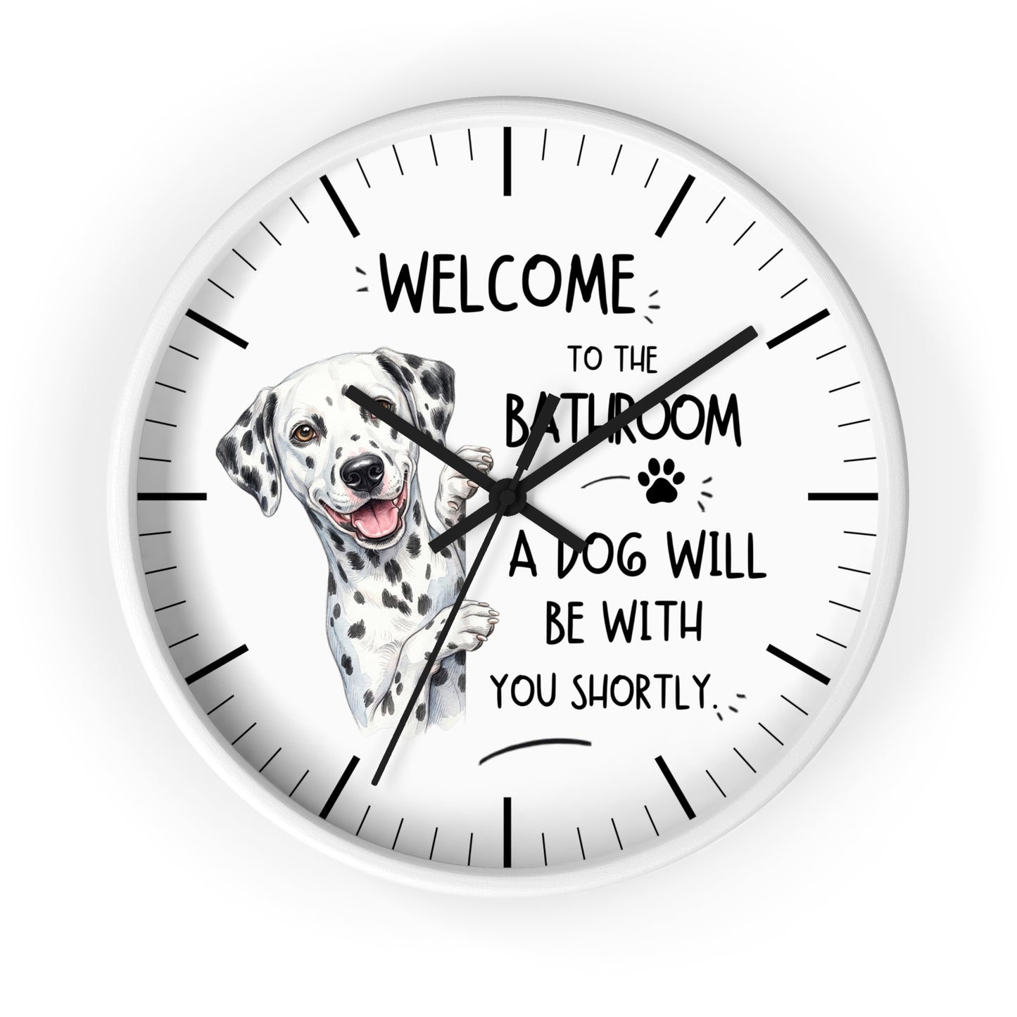 A round white wall clock with black hands and hour markers, featuring a Dalmatian illustration and the text 'WELCOME TO THE BATHROOM A DOG WILL BE WITH YOU SHORTLY' on a white background.