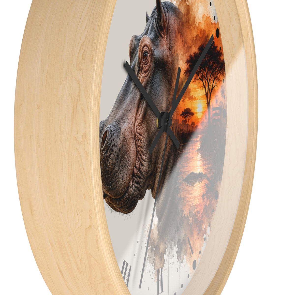 Round wall clock with a light natural wood frame and a printed design featuring a close-up hippopotamus head blending into an African savanna sunset scene, with black clock hands and Roman numerals.