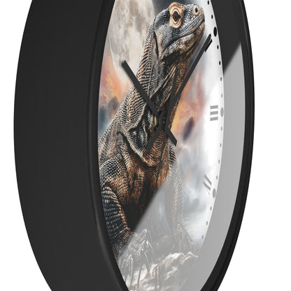 A close-up of a round wall clock with a black frame and a printed lizard illustration on the face, photographed against a plain white background.
