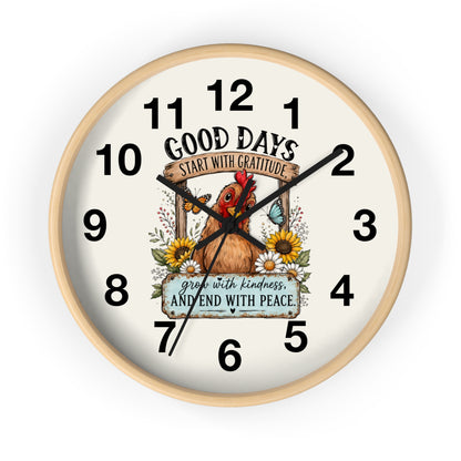 A round wall clock with a light natural wood frame and an off-white face, featuring a central illustration of a brown chicken surrounded by sunflowers and the text 'GOOD DAYS START WITH GRATITUDE' and 'grow with kindness AND END WITH PEACE'.