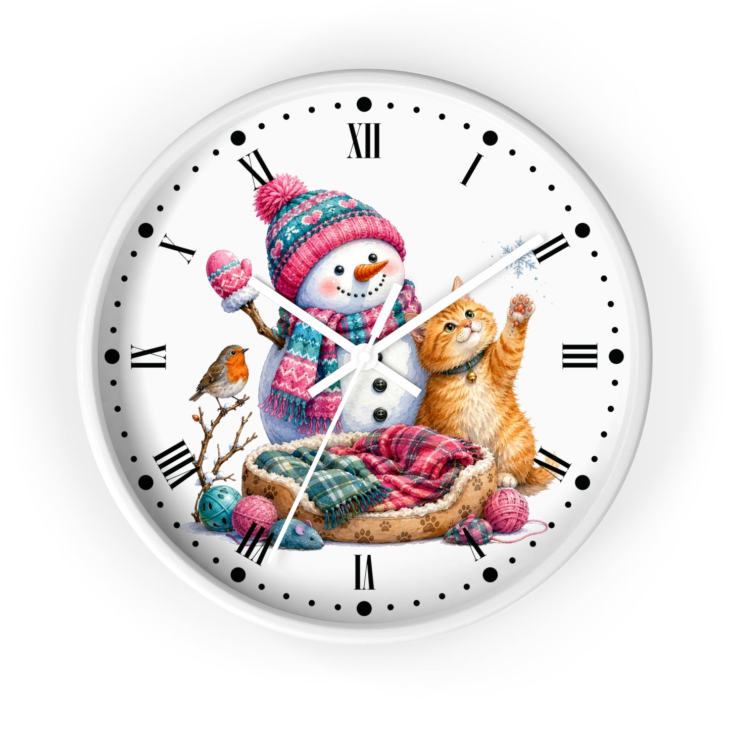 A round white wall clock with black Roman numerals and hands, featuring a colorful winter illustration on the face of a snowman in a pink knit hat, an orange tabby cat in a bed, a small bird, and yarn balls.