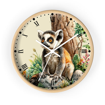 Round wall clock with a light wood frame and a printed illustration of a lemur sitting in front of a tree trunk, with Roman numerals and white clock hands on a white background.
