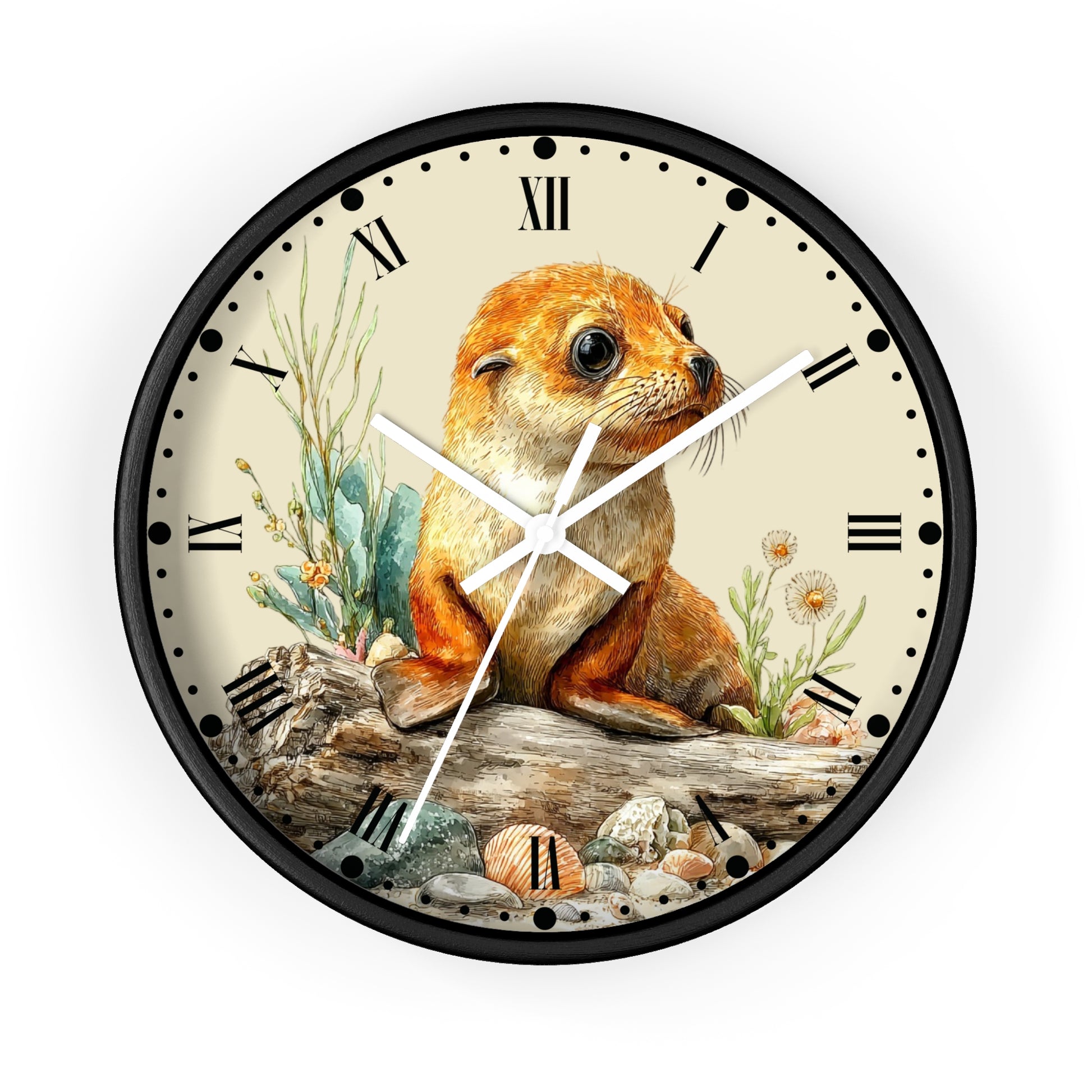 A round wall clock with a black frame and a cream-colored face featuring an illustrated seal pup sitting on driftwood with plants and shells. The clock has black Roman numerals and white hands, shown against a plain white background.