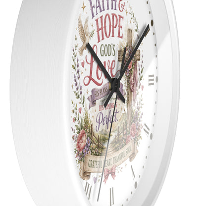A white round wall clock with a decorative religious face featuring the words 'Faith & Hope God's Love His Plans His Timing is Perfect' surrounded by floral and bird illustrations.