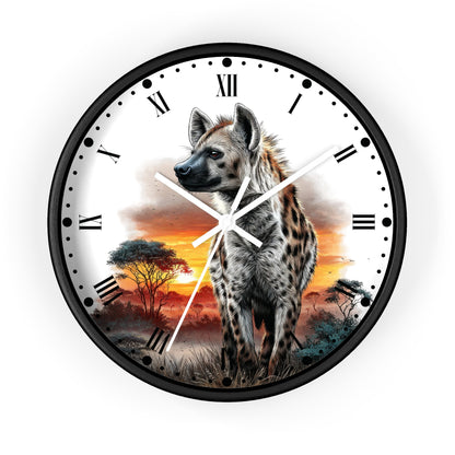 A round wall clock with a black frame and a printed safari scene featuring a spotted hyena at sunset, with black Roman numerals and white clock hands on a white face.