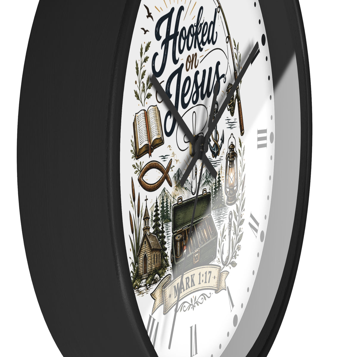 A close-up of a wall clock with a black frame and a white face featuring the text 'Hooked on Jesus' and religious illustrations including an open book, fish symbol, church, and lantern.