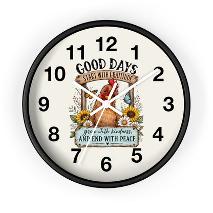 A round wall clock with a black frame and a cream-colored face, featuring a central illustration of a rooster, sunflowers, and a butterfly with the text 'GOOD DAYS START WITH GRATITUDE' and 'GROW WITH KINDNESS AND END WITH PEACE.'.
