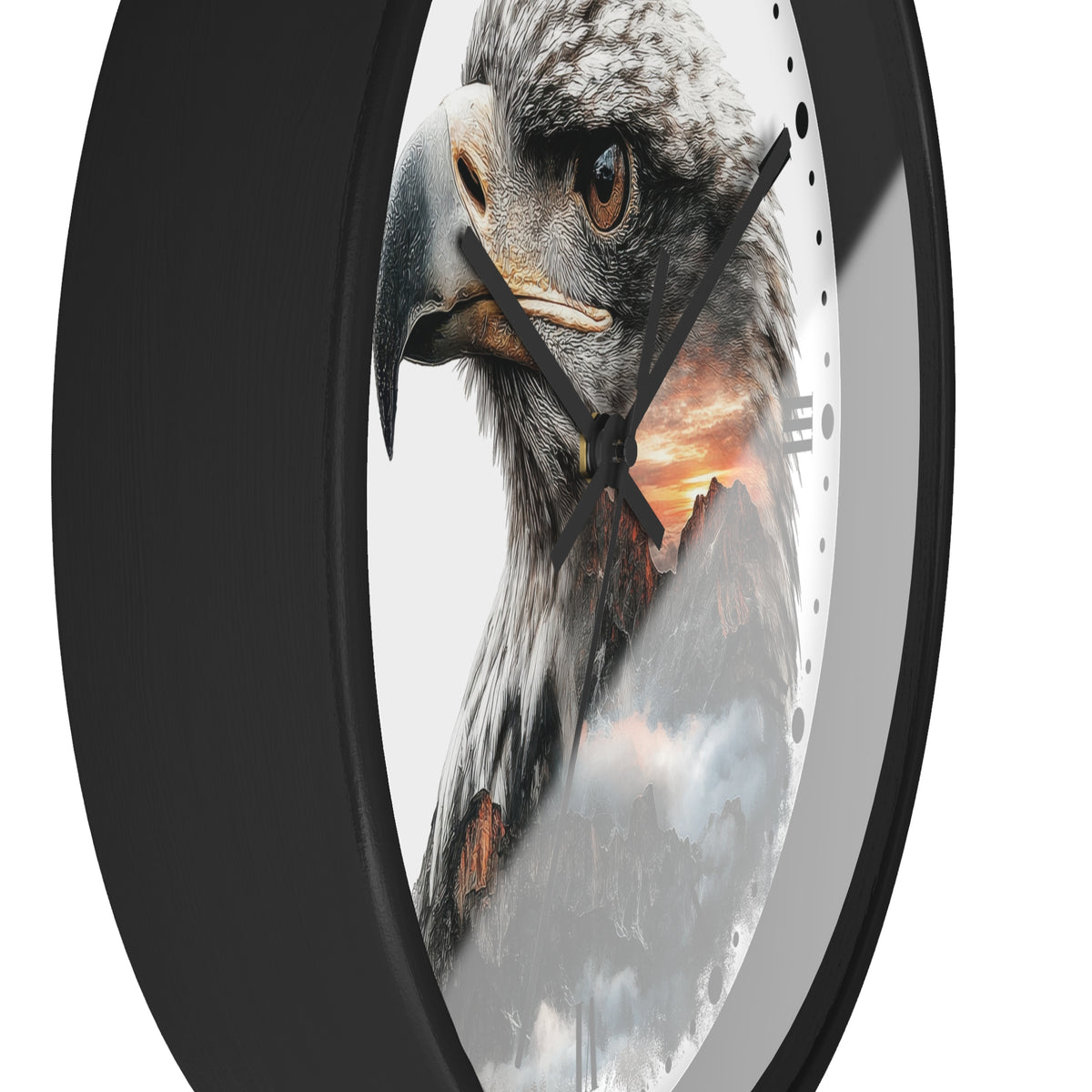 A close-up of a round wall clock with a black frame and a printed face featuring a large eagle head over a mountain sunset scene.
