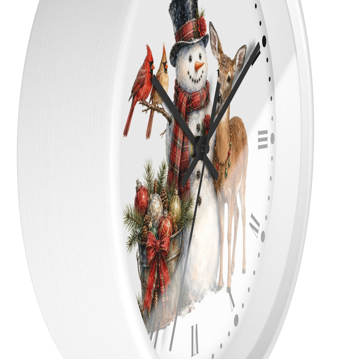 A white round wall clock with a festive Christmas illustration on the face, featuring a snowman in a black top hat and red plaid scarf, two red cardinals, a deer, evergreen branches, ornaments, and black Roman numerals.