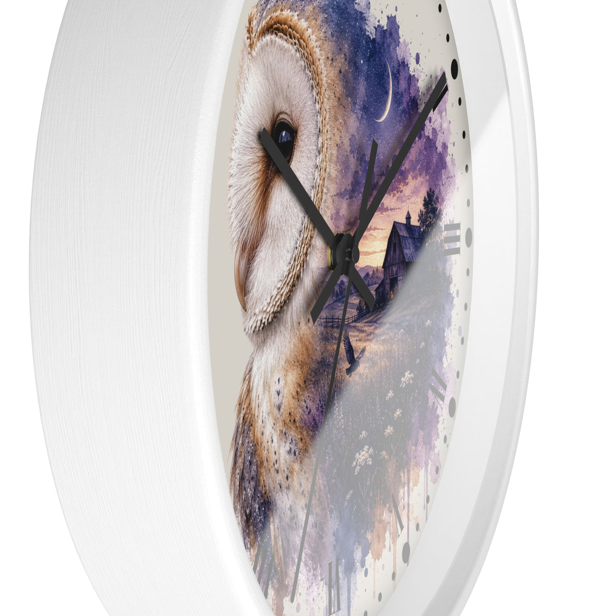 A round wall clock with a white frame, black hands, and a printed owl artwork on the face. The design shows a large white and brown owl over a purple and blue watercolor landscape with a house and moon.