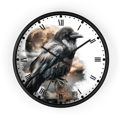 A round wall clock with a black frame and a printed raven design on the face, featuring Roman numerals, black hour and minute hands, and a cloudy moon background.