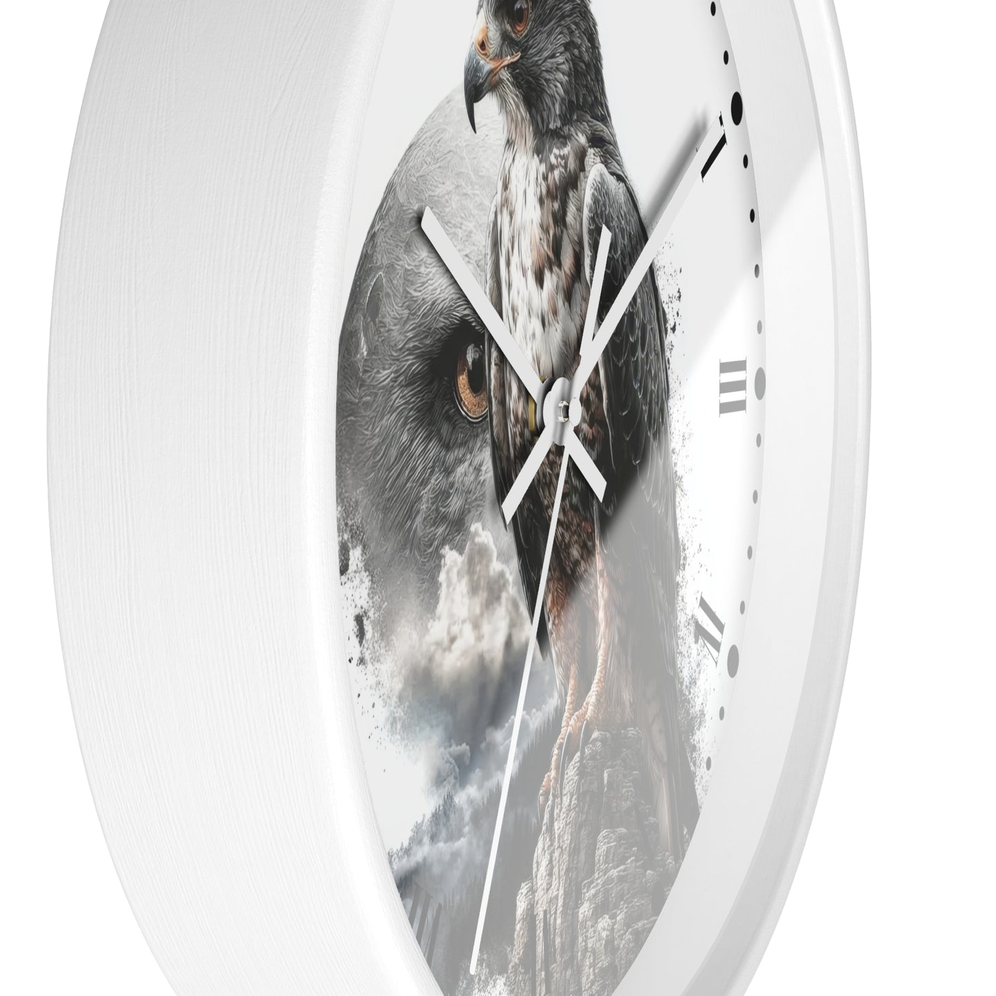 A round white wall clock with a printed design of a large bird of prey over a mountainous scene, shown against a plain white background.