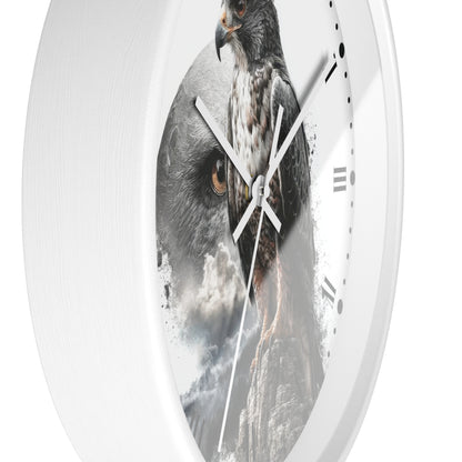 A round white wall clock with a printed design of a large bird of prey over a mountainous scene, shown against a plain white background.