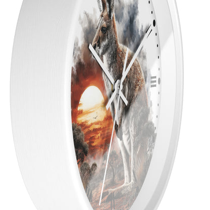 A white round wall clock featuring a printed scenic artwork of a kangaroo in front of a dramatic sunset sky, with white clock hands and no visible brand text.