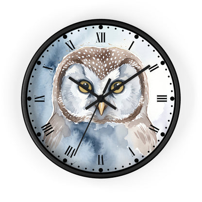 Round wall clock with a black frame and Roman numerals, featuring a watercolor-style owl illustration on the face with blue-gray background wash and black hands.