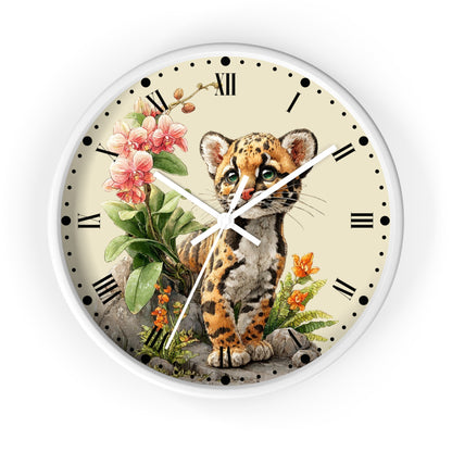 Round wall clock with a white frame and a cream-colored face, featuring an illustration of a snow leopard surrounded by pink flowers, green leaves, and small orange blossoms. The clock has black Roman numerals and white hands.