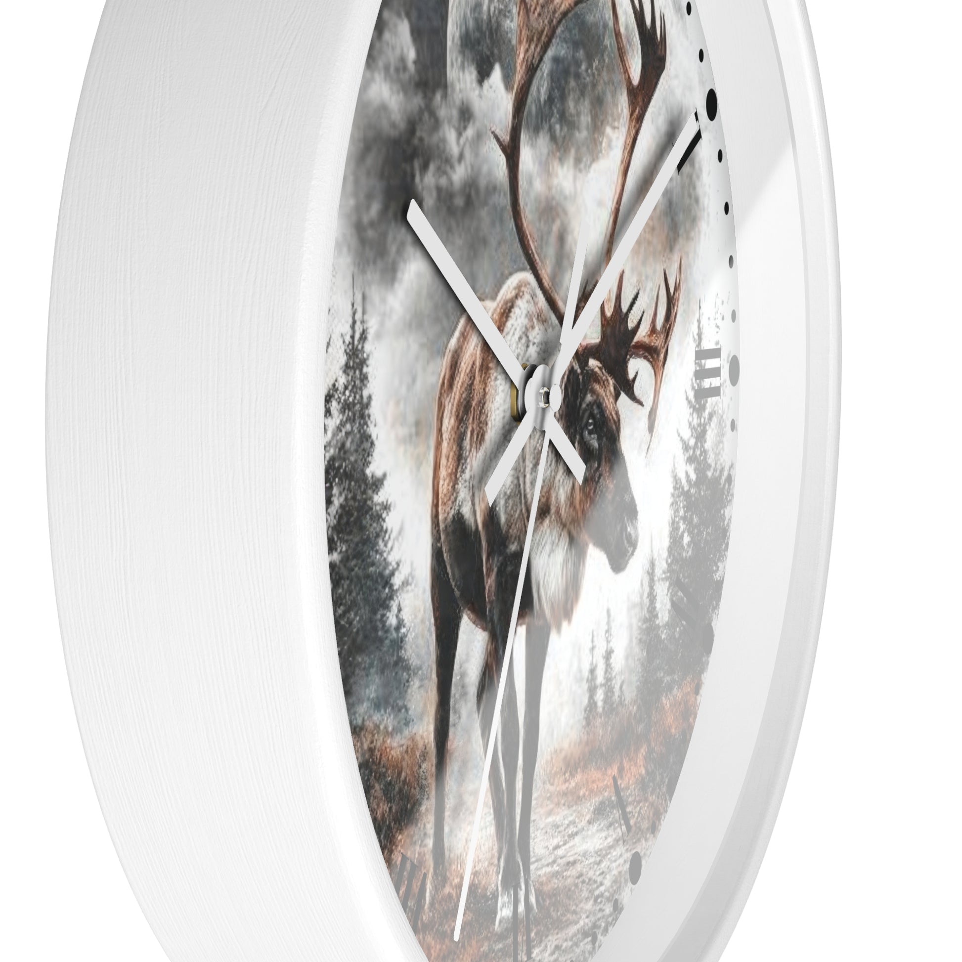 A round white wall clock featuring a printed nature scene of a large deer with antlers standing in a misty forest, shown against a plain white background.