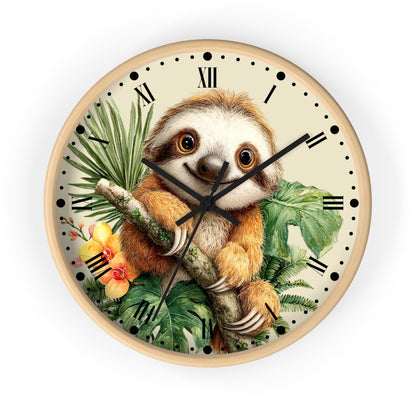 A round wall clock with a light wood frame featuring an illustration of a smiling sloth holding a branch among tropical green leaves and yellow flowers on a cream background with black Roman numerals.