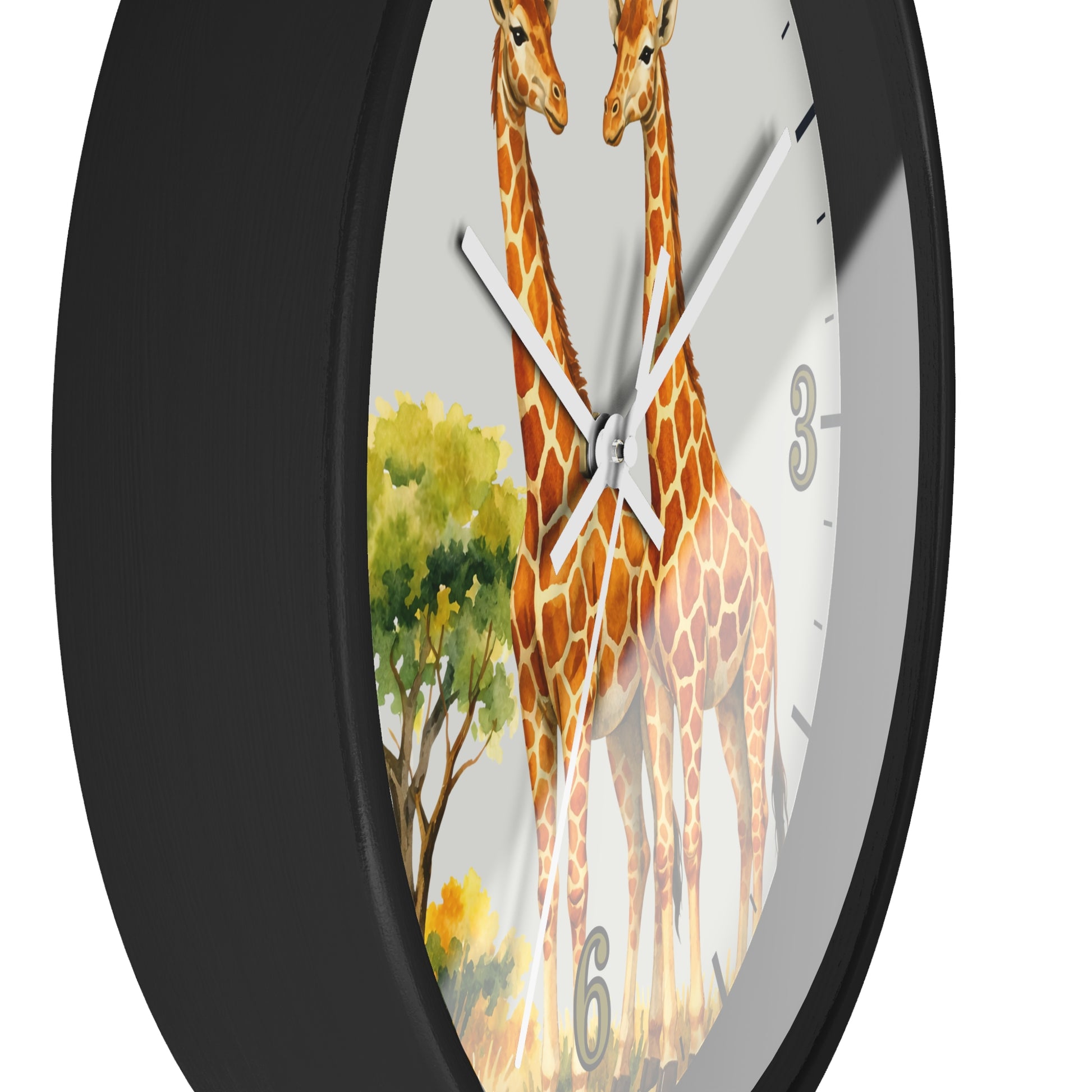 A close-up of a round wall clock with a black frame and a white clock face featuring a watercolor-style illustration of two giraffes and a tree.