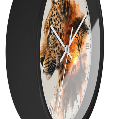 Round wall clock with a black frame and a printed face featuring a leopard profile blending into an African savanna sunset scene, shown on a white background.