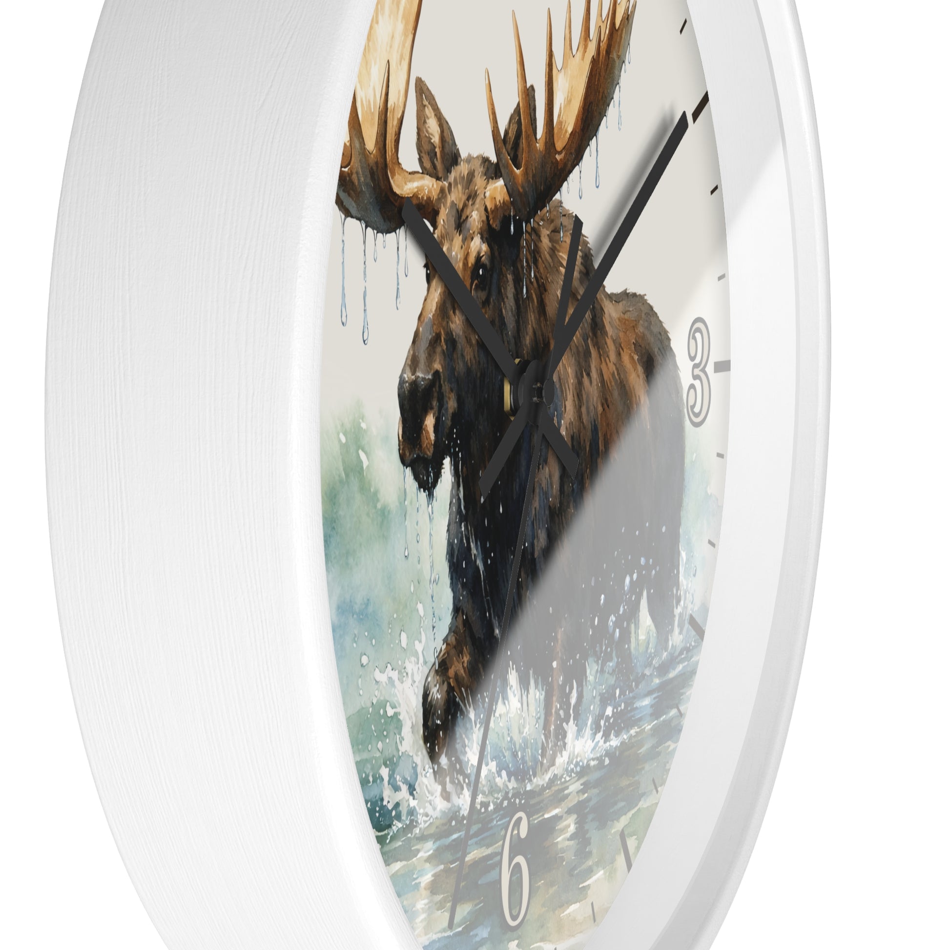 A white round wall clock featuring a printed illustration of a moose standing in water, with black hands and partial white numerals visible on the face.