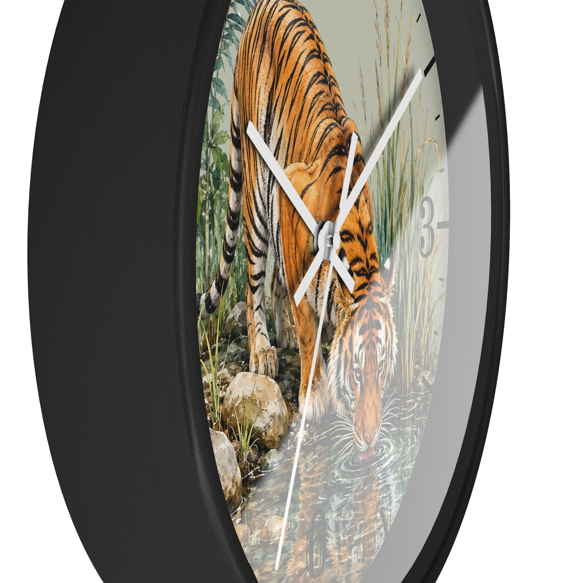Round wall clock with a black frame and a printed tiger drinking water scene on the face, shown against a plain white background.