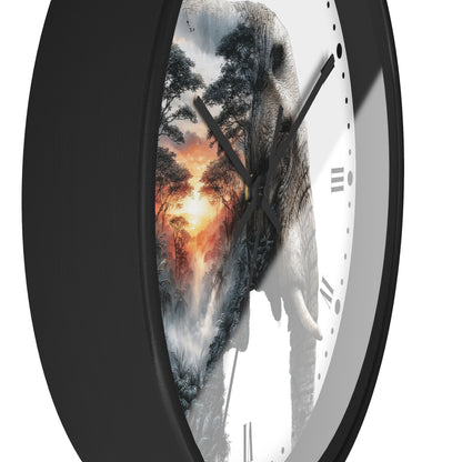 A close-up of a round wall clock with a black frame and a white face, featuring a double-exposure design of a forest landscape and a elephant. The clock is shown against a plain white background.