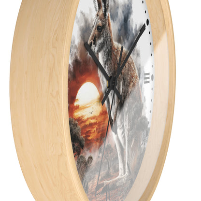 Round wall clock with a light natural wood frame and a printed artwork of a kangaroo in front of a dramatic sunset sky, shown on a white background.