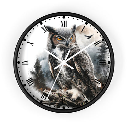 Round wall clock with a black frame and a printed design of a large owl perched in a misty forest, with black Roman numerals and white clock hands on a white background.