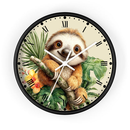 A round wall clock with a black frame and a cream-colored face, featuring a detailed illustration of a smiling sloth holding a branch among tropical green leaves and yellow flowers. The clock has black Roman numerals and white hands, shown against a plain white background.