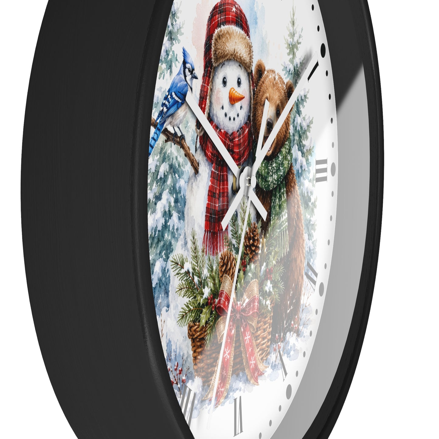 A round wall clock with a black frame and a festive winter illustration on the face, featuring a snowman in a red scarf, pine trees, pinecones, and a bluebird on a white background.