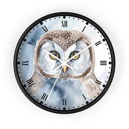 A round wall clock with a black frame and a watercolor-style owl illustration on the face. The clock has Roman numeral hour markers, white hands, and is shown against a plain white background.