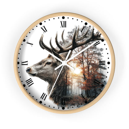 A round wall clock with a light wood frame and a printed dial featuring a large deer head in profile over a forest scene with Roman numerals and black dot hour markers.