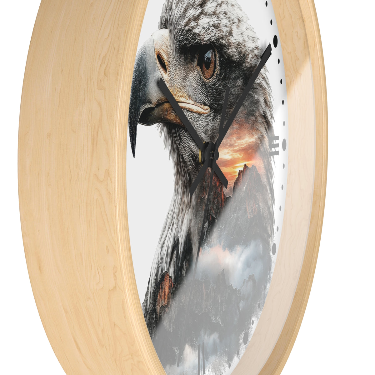 Round wall clock with a light natural wood frame and a printed design of a large eagle over mountains and a sunset on the clock face.