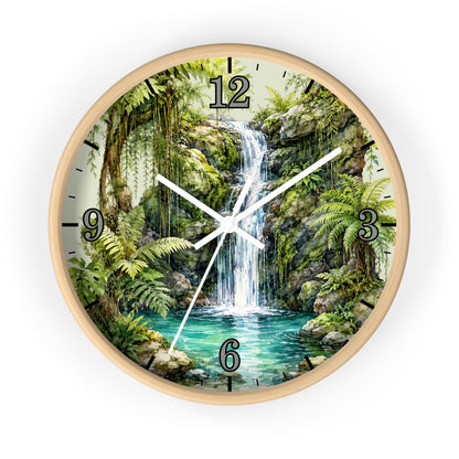 A round wall clock with a light wood frame and a printed tropical jungle waterfall scene on the face, with black Arabic numerals and white clock hands, shown against a plain white background.