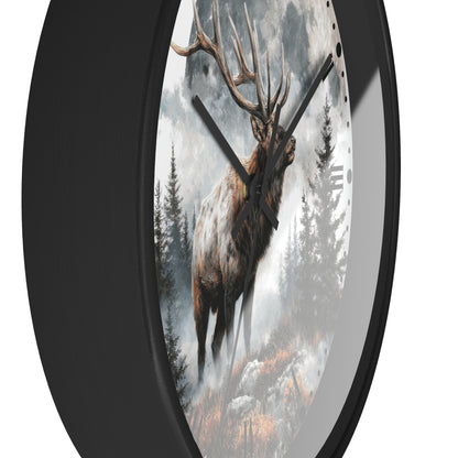 A round wall clock with a black frame and a printed scenic design featuring a large elk standing in a misty forest under a cloudy sky.