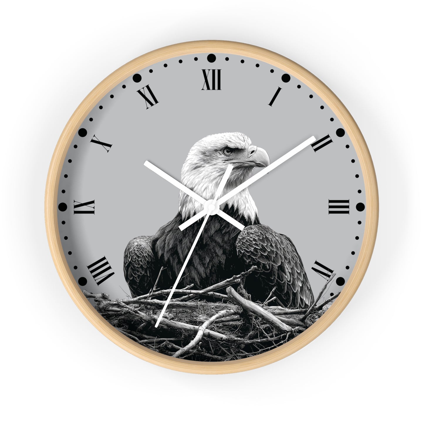 Round wall clock with a light wood frame, a gray face, black Roman numerals, and a black-and-white photograph of a bald eagle in a nest.