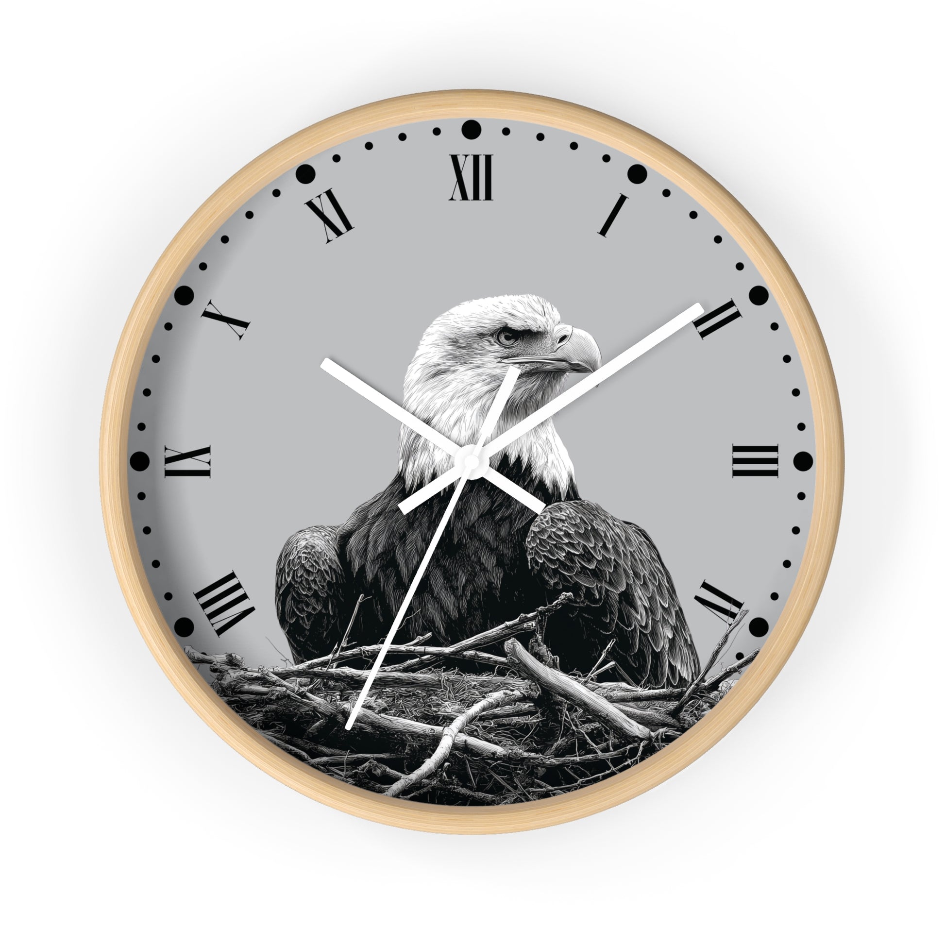 Round wall clock with a light wood frame, a gray face, black Roman numerals, and a black-and-white photograph of a bald eagle in a nest.