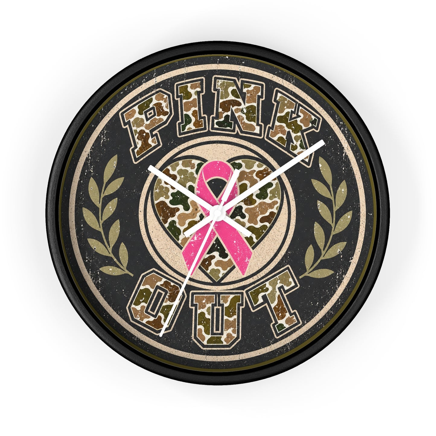A round wall clock with a black frame and a distressed design featuring the words 'PINK OUT' in camouflage lettering, a pink ribbon heart in the center, and olive green laurel branches on a light gray background.