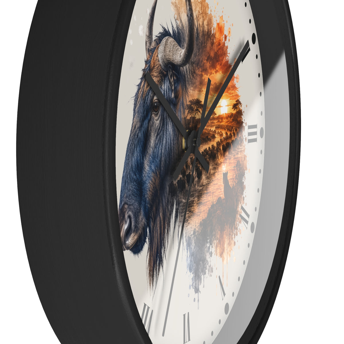 A close-up of a round wall clock with a black frame and a white dial featuring a painted bison head and an orange sunset landscape design.