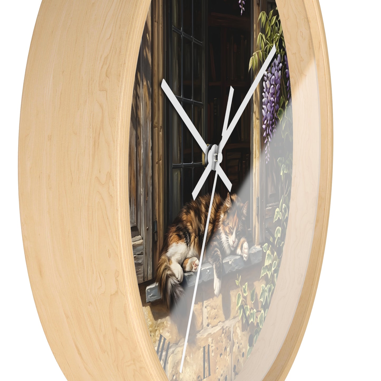Round wall clock with a light natural wood frame and a printed scene of a calico cat resting on a windowsill, with white clock hands and a thin second hand.