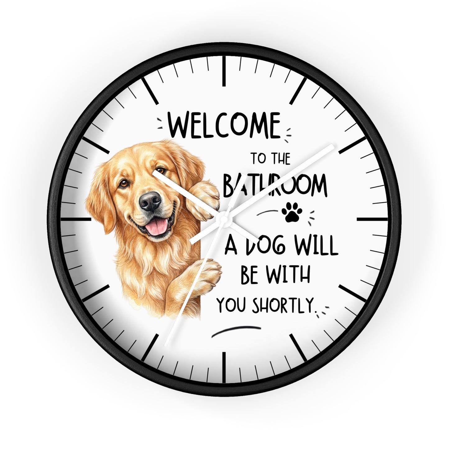 A round wall clock with a black frame and white face, featuring a golden retriever illustration and the text 'WELCOME TO THE BATHROOM A DOG WILL BE WITH YOU SHORTLY.' on a light gray background.
