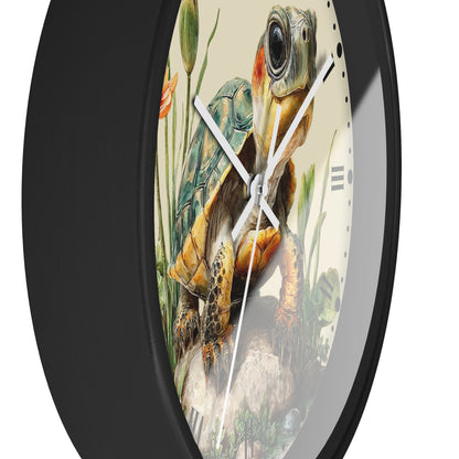 A round wall clock with a black frame and a cream-colored face featuring a detailed illustration of a sea turtle in a naturalistic scene with aquatic plants.