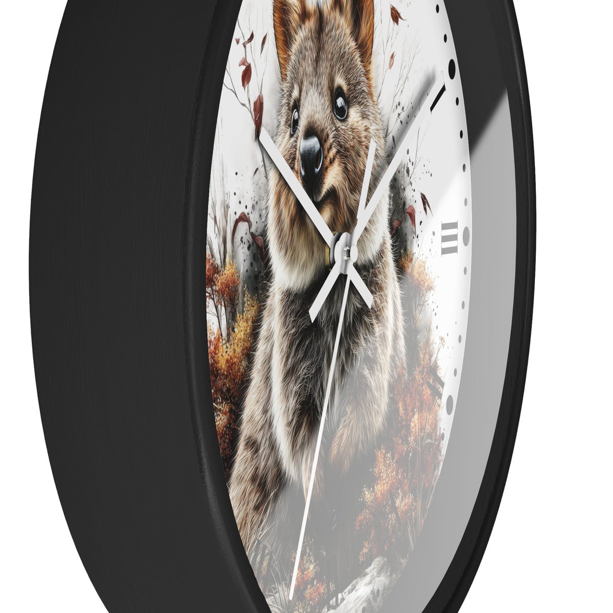 A round wall clock with a black frame and a printed quokka in autumn design on the face, with white hands and black hour markers, shown against a plain white background.