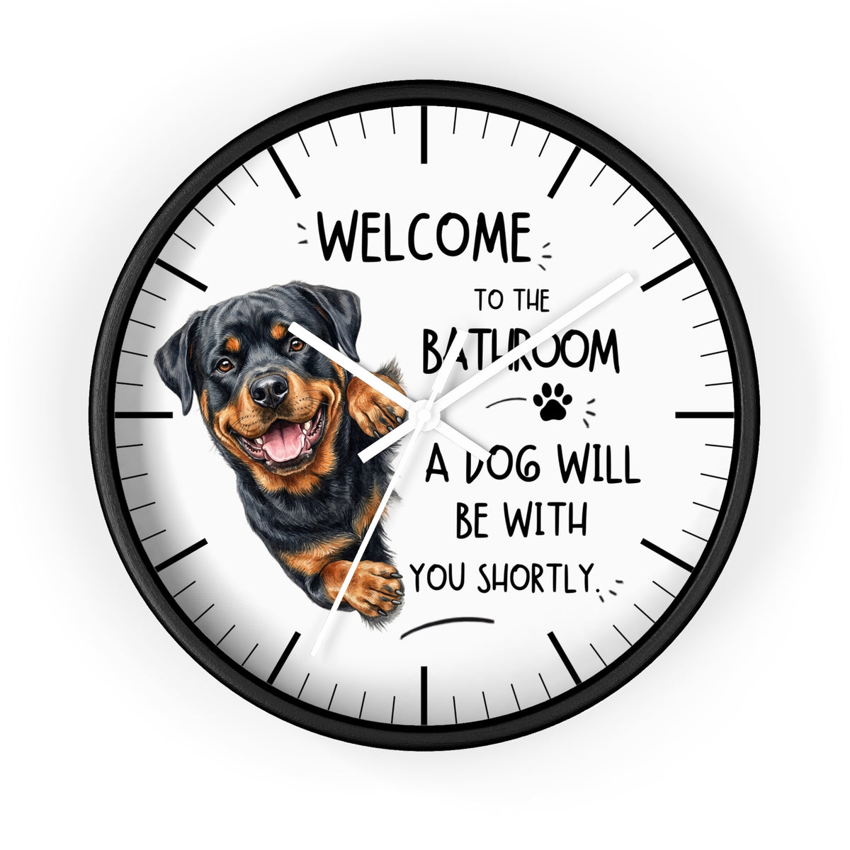 A round wall clock with a black frame and a white face featuring a Rottweiler dog illustration and the text 'WELCOME TO THE BATHROOM A DOG WILL BE WITH YOU SHORTLY.'.