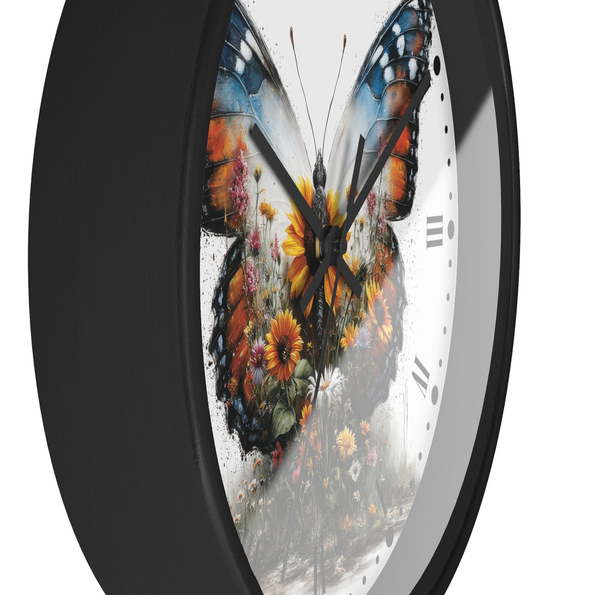 A round wall clock with a black frame and a white face featuring a large colorful butterfly made of floral artwork in orange, yellow, blue, and green.