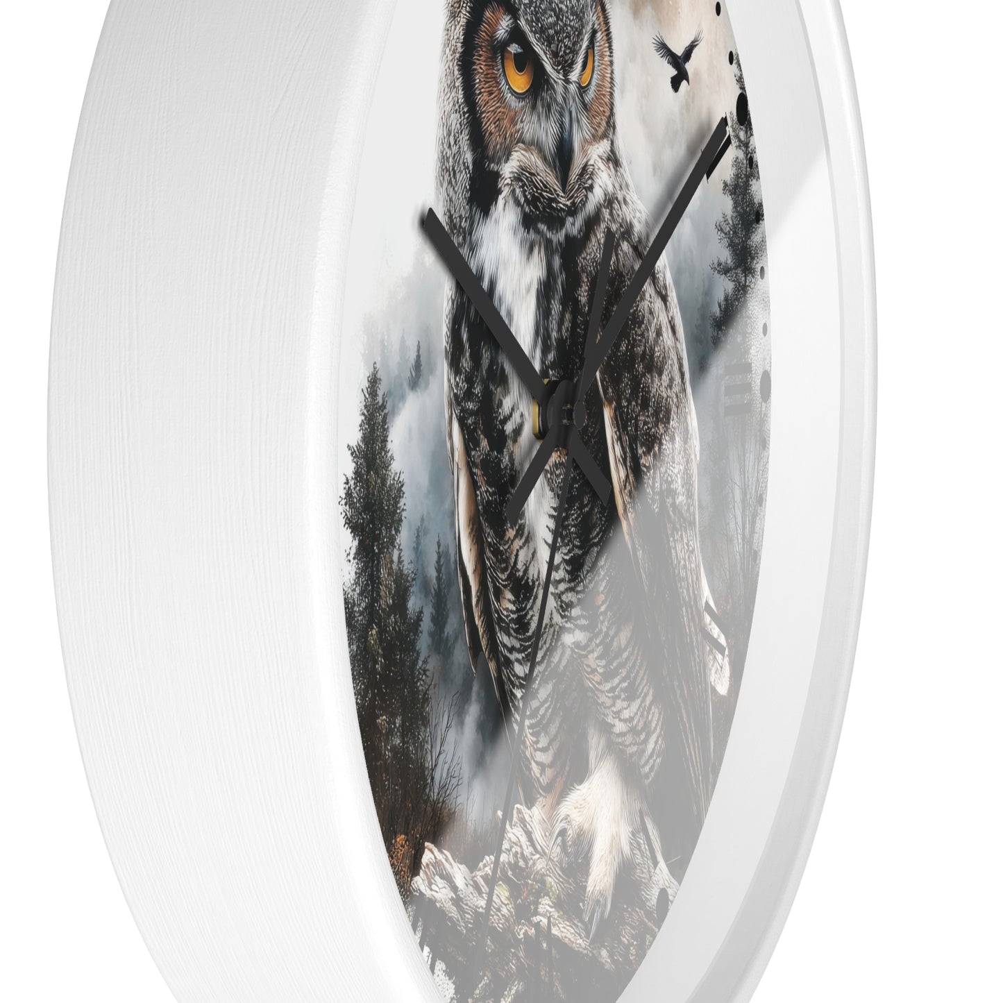 A round wall clock with a white outer frame and a printed owl illustration on the face. The owl artwork shows gray, brown, black, and white tones with small orange eyes, set against a misty forest scene.