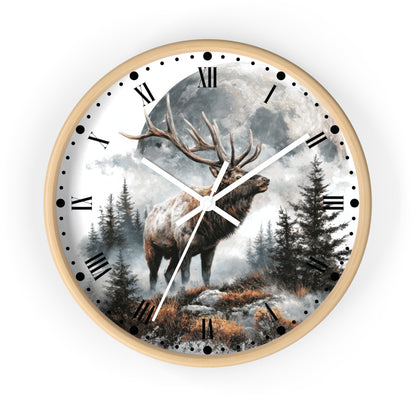 A round wall clock with a light wood frame and a printed scenic dial showing a large deer standing in a misty forest under a full moon. The clock uses black Roman numerals for hour markers and white hands.
