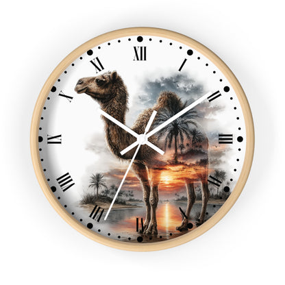 A round wall clock with a light wood frame and a printed camel scene on the face. The dial has black Roman numerals, black dot hour markers, white clock hands, and a scenic print of a camel standing in a desert landscape at sunset.