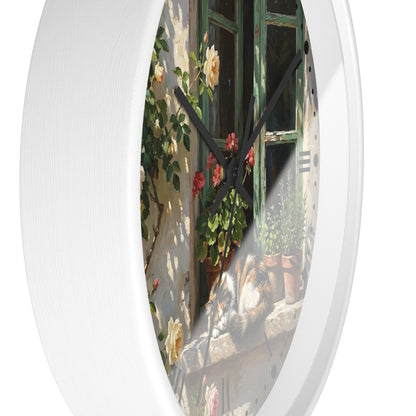 Round wall clock with a white frame and a printed scenic dial showing a sunlit window, climbing roses, potted plants, and a cat, photographed against a white background.